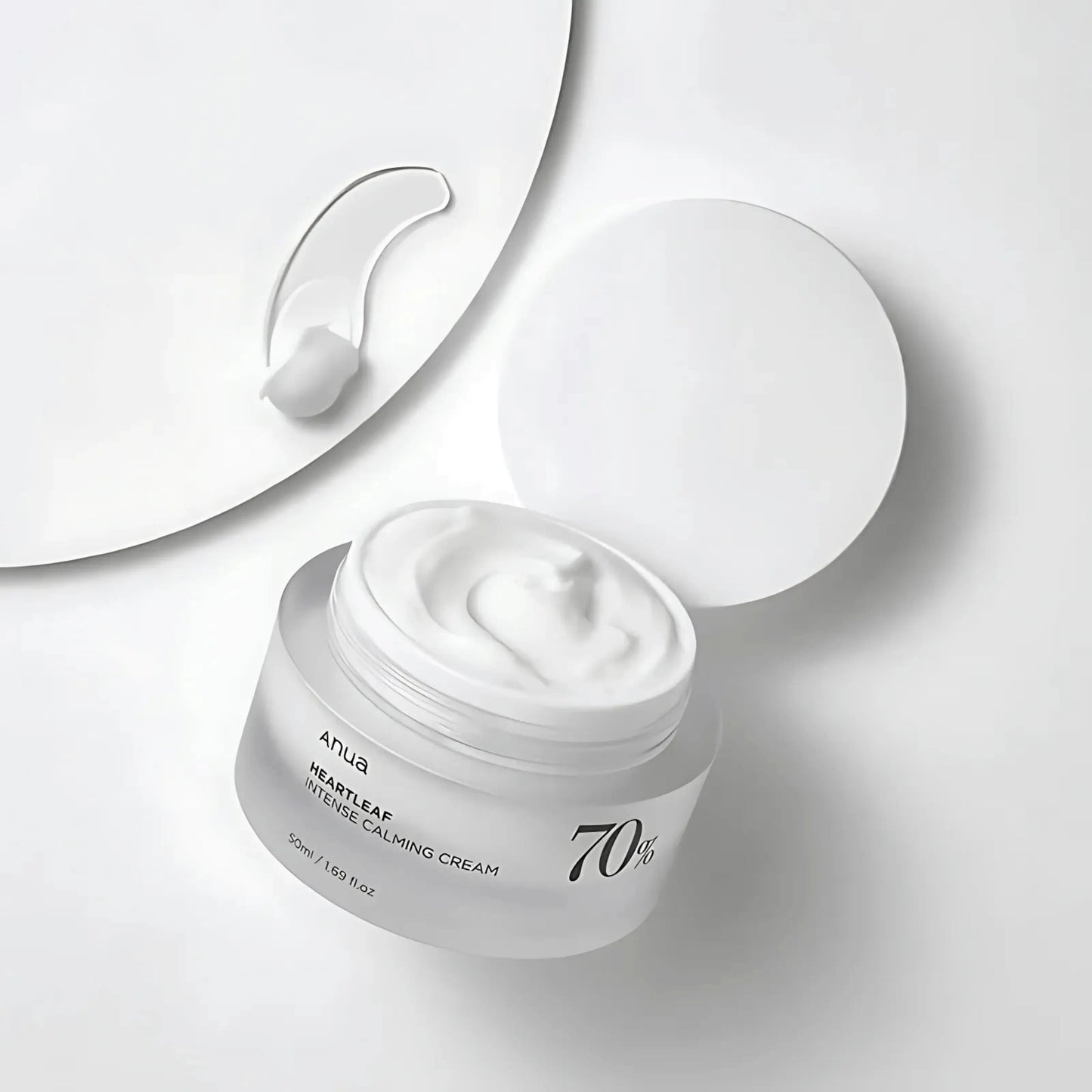 ANUA Heartleaf 70% Intense Calming Cream com tampa aberta e textura visível – creme facial nutritivo e suave com houttuynia cordata para reduzir vermelhidão, cosmética coreana, skincare k-beauty Portugal