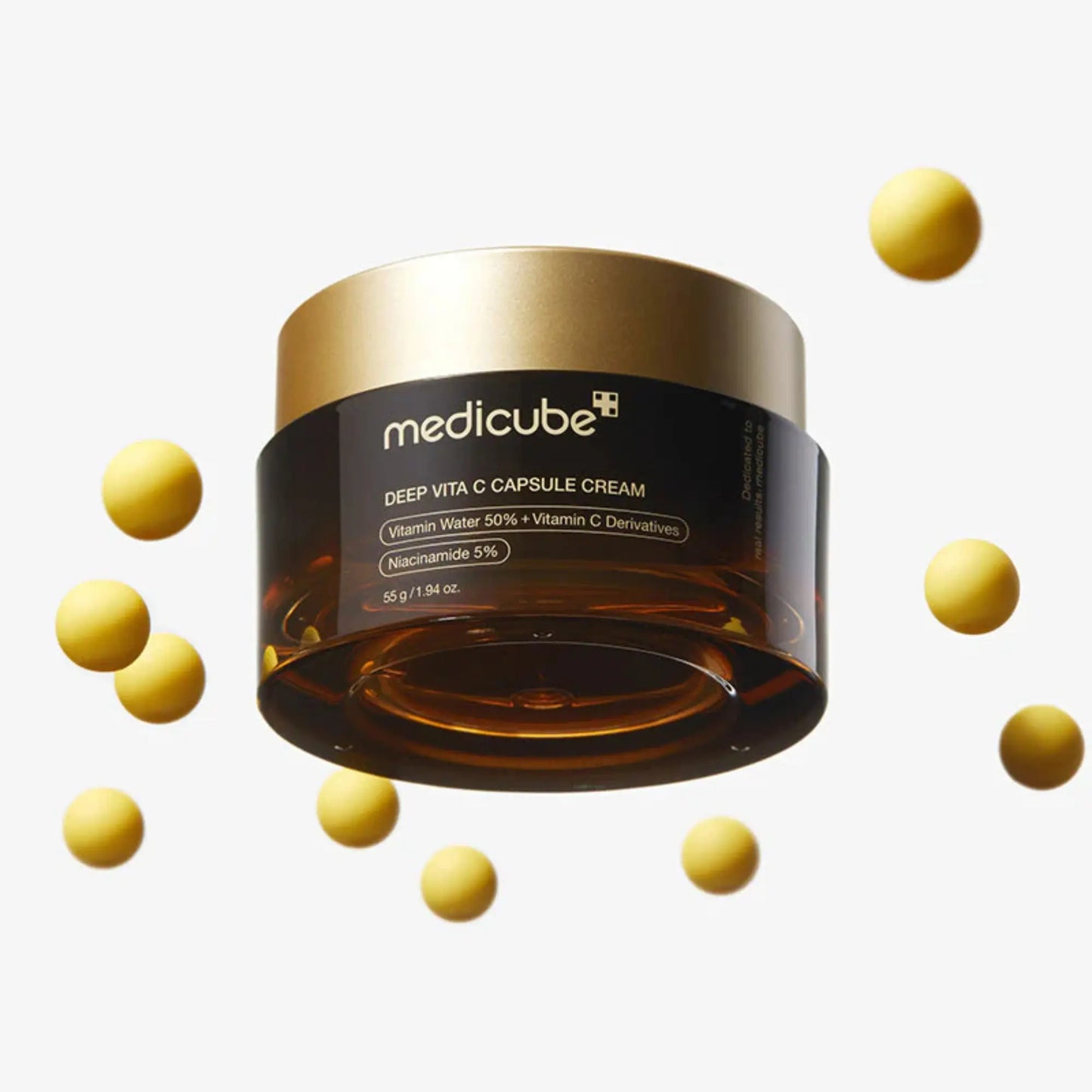 Medicube Deep Vita C Capsule Cream 55g, creme coreano antioxidante com vitamina C pura encapsulada para luminosidade, redução de manchas e pele uniforme, frasco fechado com cápsulas douradas a flutuar ao redor sobre fundo branco, cosmética coreana skincare k-beauty Portugal.