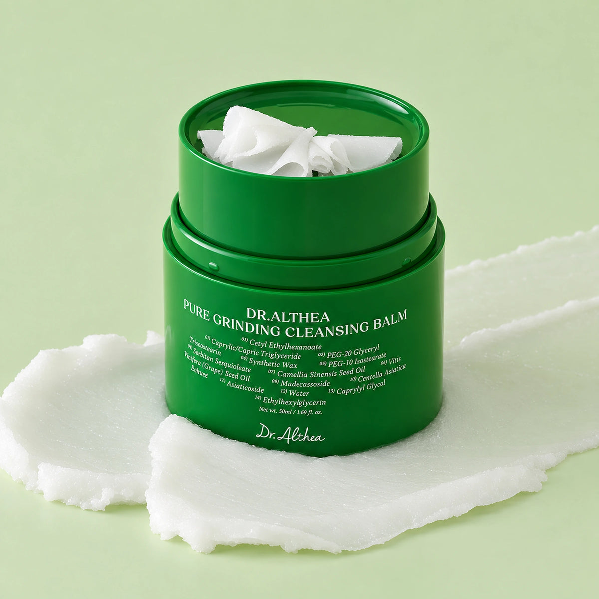 Dr. Althea Pure Grinding Cleansing Balm aberto, com lâminas de bálsamo e textura espalhada na base.