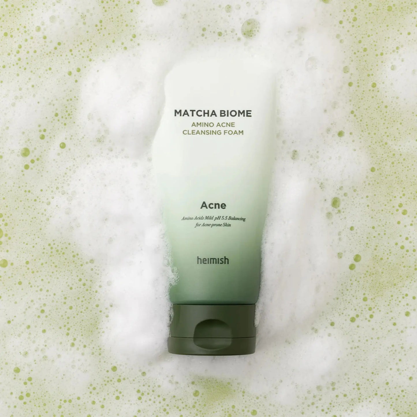 Heimish Matcha Biome Amino Acne Cleansing Foam 150g, espuma de limpeza coreana para pele oleosa e acneica, com matcha antioxidante e aminoácidos calmantes, textura de espuma abundante com bolhas verdes, frasco no fundo, cosmética coreana skincare k-beauty Portugal.