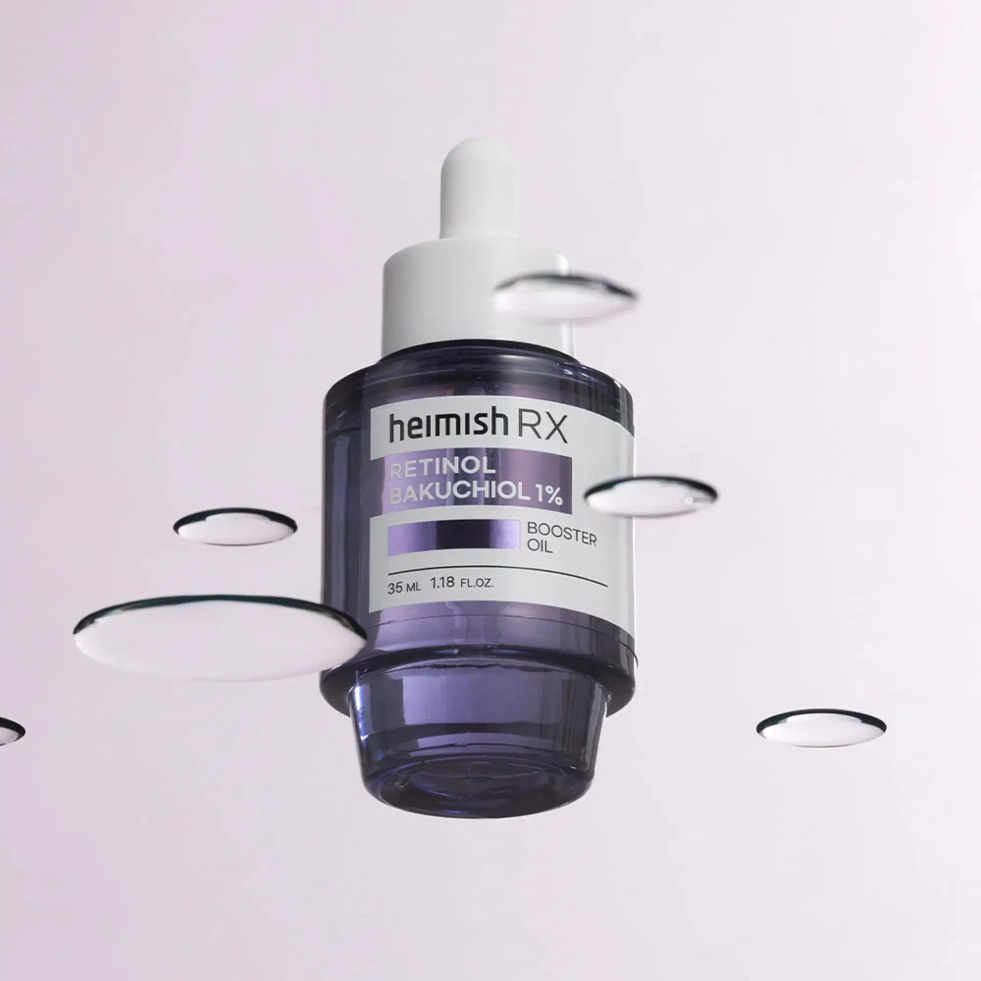 Heimish RX Retinol Bakuchiol Booster Oil 35ml, óleo facial coreano anti-envelhecimento com retinol e bakuchiol, promove firmeza, regeneração e pele luminosa, frasco em pé com conta-gotas a aplicar óleo, fundo lilás, cosmética coreana skincare k-beauty Portugal.
