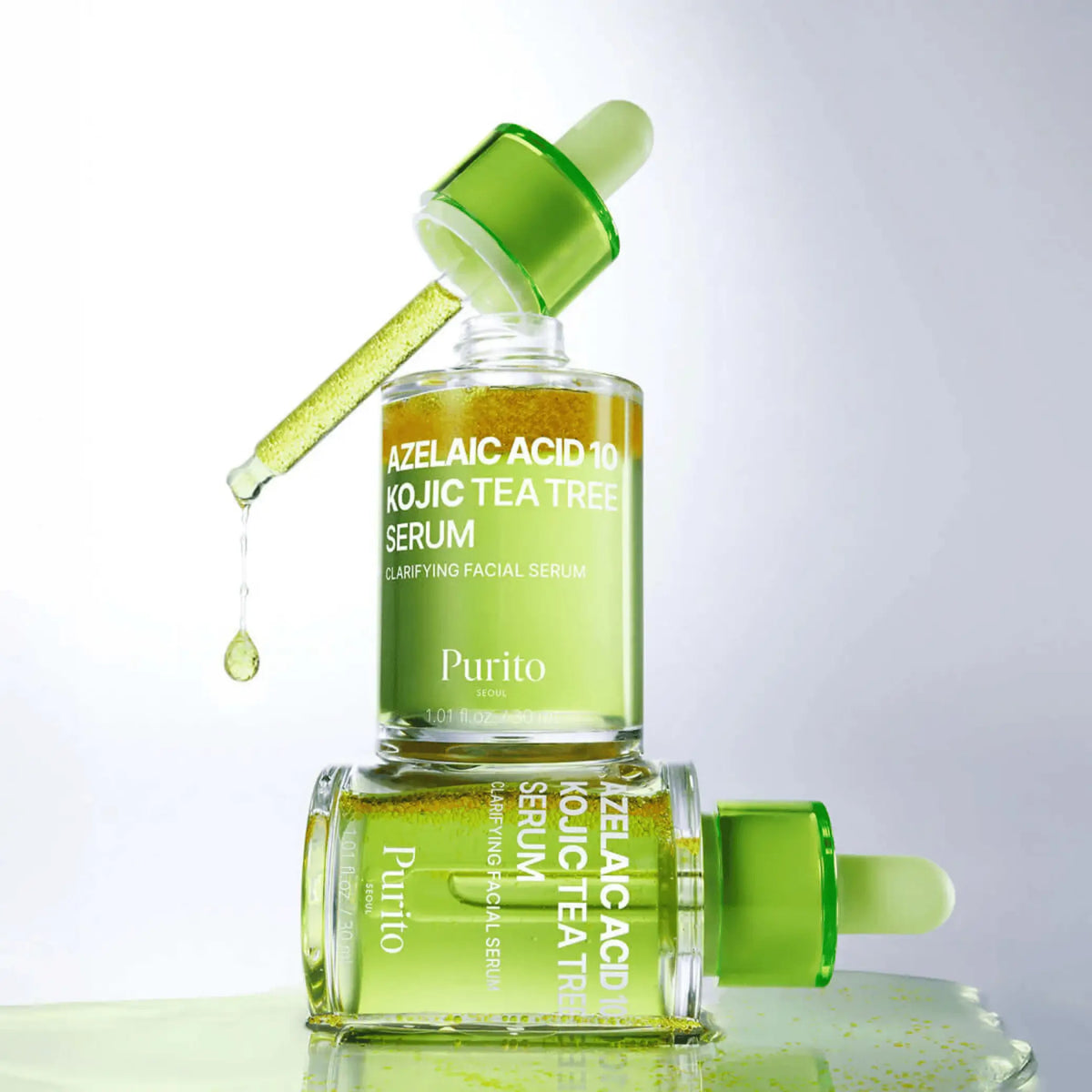 Azelaic Acid 10 Kojic Tea Tree Serum da Purito SEOUL dois frascos empilhados com pipeta e gota a cair