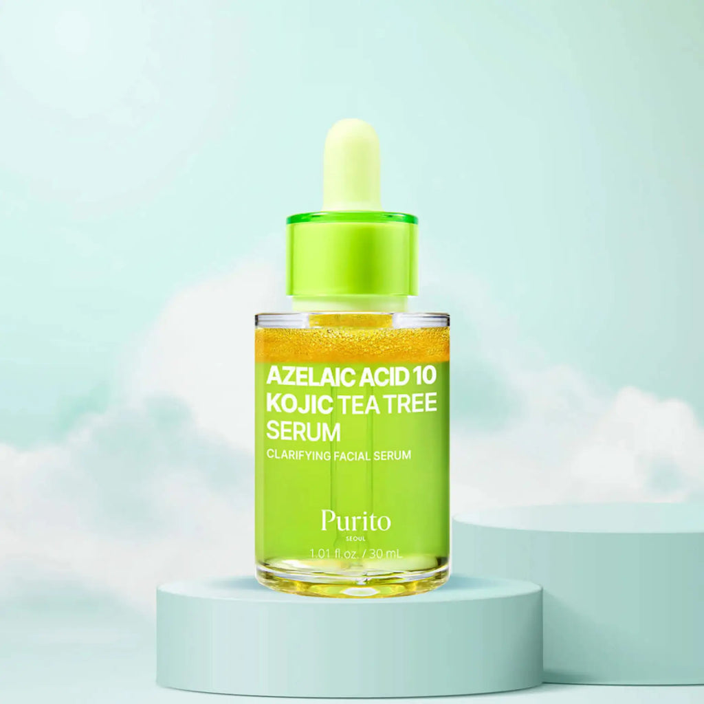 Azelaic Acid 10 Kojic Tea Tree Serum da Purito SEOUL em frasco com conta-gotas sobre base com fundo de céu