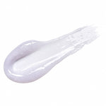Textura em bálsamo da máscara labial TOCOBO Collagen Boosting Lip Mask espalhada sobre fundo branco.